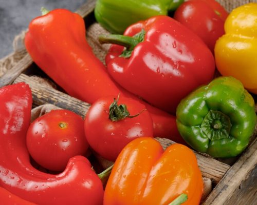 red-green-yellow-vegetables-rustic-tray-top-view_114579-6151